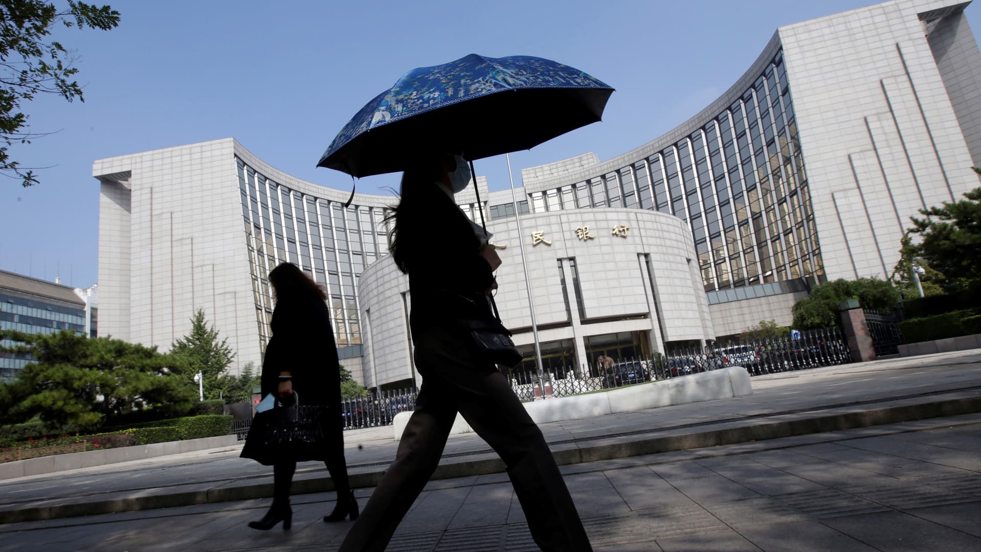 China’s financial regulators urge support for resolving local debt risks